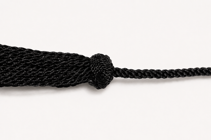 Black rope with a knot on a white background
