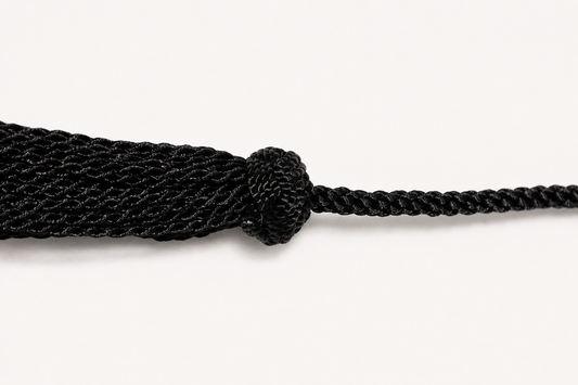 Black rope with a knot on a white background