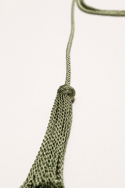 Green chain tassel on a white background