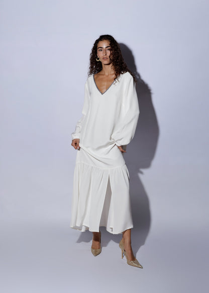 Woman wearing an elegant white silk dress 