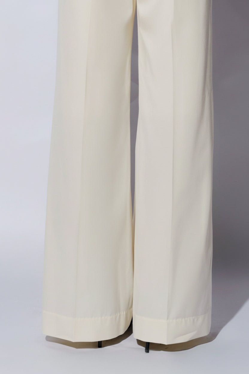 Ivory wide-leg pants worn by a person on a white background