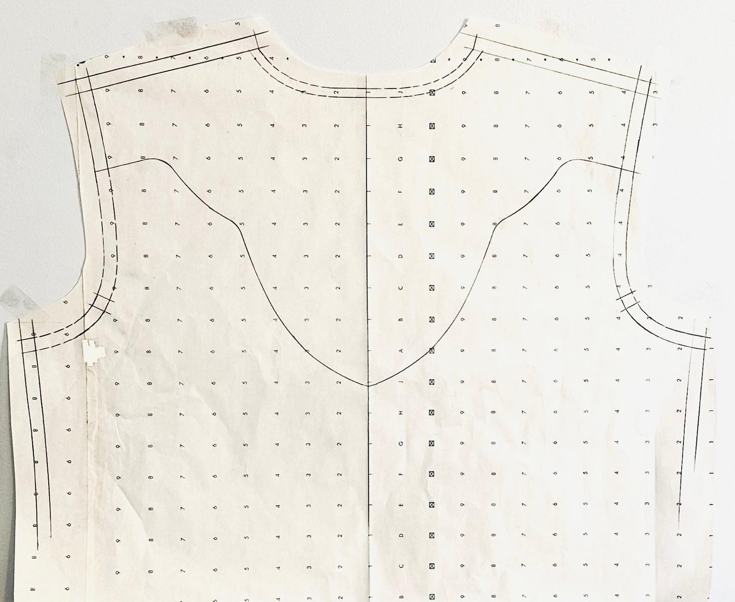 Patterned fabric with sewing lines on a white background